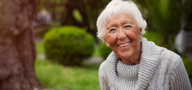 Senior Woman Smiling Outside