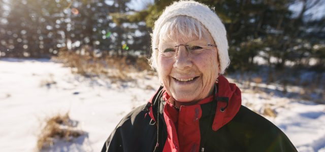 Portrait of a senior woman standing outdoors in winter, United States